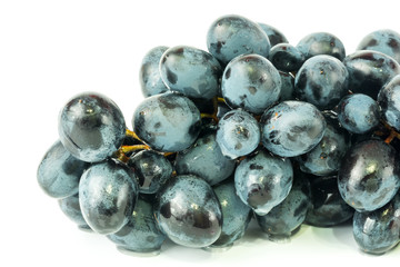 black grapes drops of water white background