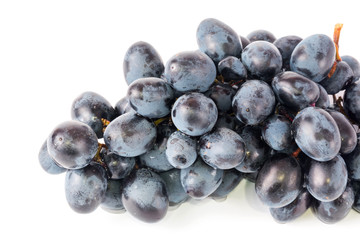 black grapes drops of water white background