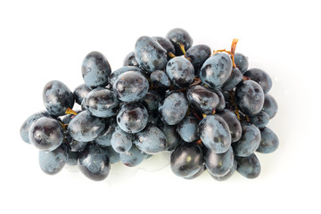 black grapes drops of water white background