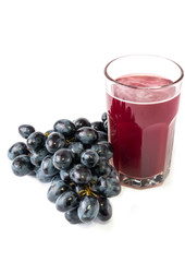 black grapes glass of grape juice white background
