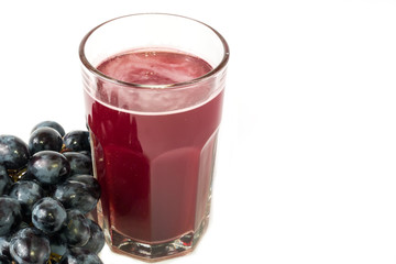 black grapes glass of grape juice white background