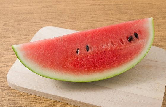 Piece of Ripe Watermelon on A Cutting Board
