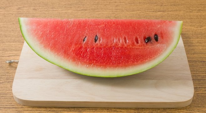 Fresh Ripe Watermelon on A Wooden Board