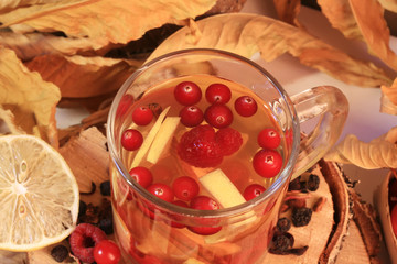 Fall mulled hot tea with fruit apple cranberry raspberry lemon