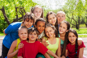 Fototapeta premium Close-up view of teenagers sitting and hugging