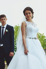 Wedding couple together in park. Bride and groom.