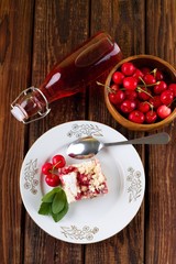 Top view on table with lemonade and cherry cake