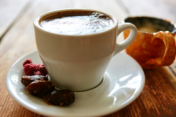 Cup of coffee on a wooden background