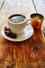 Cup of coffee on a wooden background