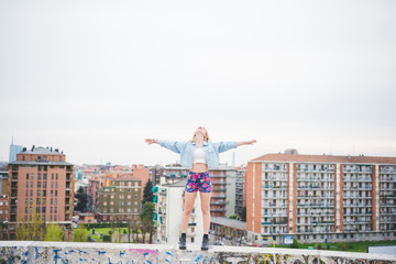 Young beautiful blonde caucasian girl posing