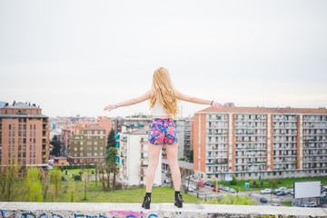 Young beautiful blonde caucasian girl posing