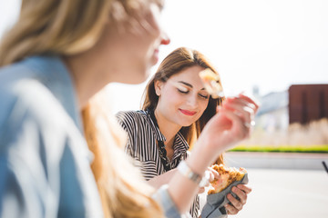 Two young handsome girls having an happy hour