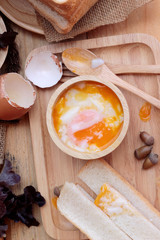 Fototapeta na wymiar soft-boiled egg with bread on wood background.