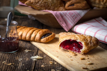 breakfast pastries with jam and milk