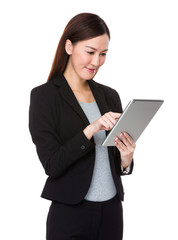 Businesswoman use of the digital tablet