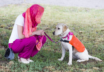 Trainer with labrador retriever guide dog