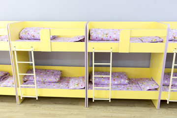Obraz na płótnie Canvas Modern kindergarten bedroom with small beds