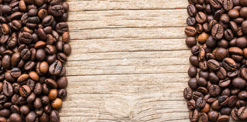 Background with coffee beans and wood texture