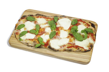 Margherita pizza on a wooden cutting board