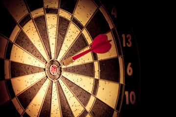 Success hitting target aim goal achievement. Red dart in target