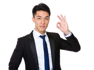 Asian businessman with ok sign gesture