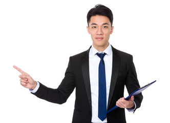 Businessman holding a clipboard and finger point up