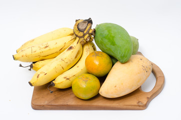 Fresh fruits and on the wooden board