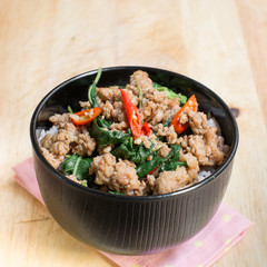 Close up Rice topped with stir fried minced pork and basil