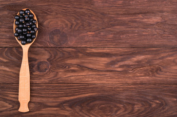 Black currants in spoon