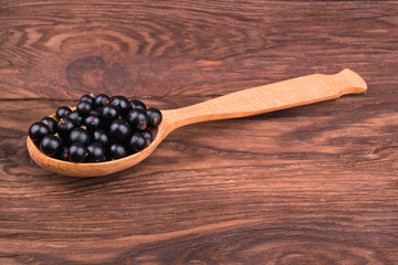 Black currants in spoon