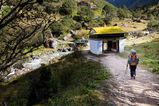 Woman backpacker hiking trail in Nepal.