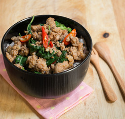 Close up Rice topped with stir fried minced pork and basil