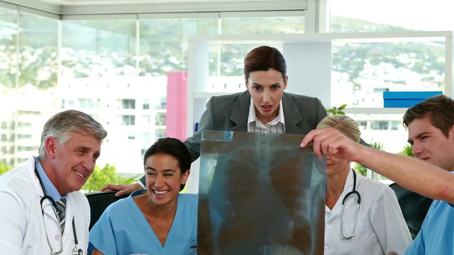 Medical team looking at Xray during meeting 