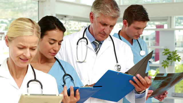 Serious medical team working in medical office
