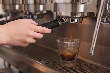 Close-up of barista making coffee 