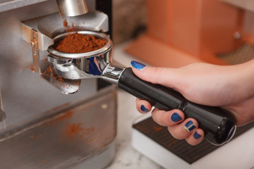 Close up of barista preparing fresh coffee 