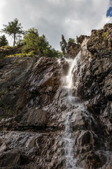 mountain waterfall among the rocks