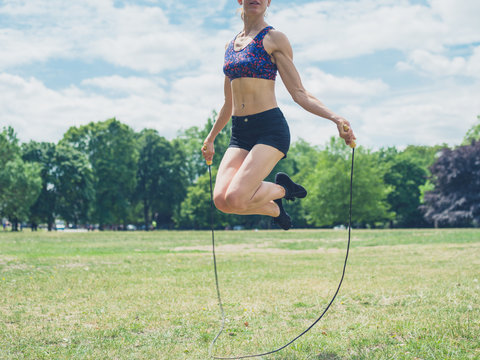 Woman skipping in the park