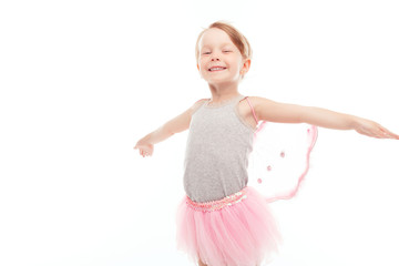 Naklejka premium Little nice girl keeping hands aside