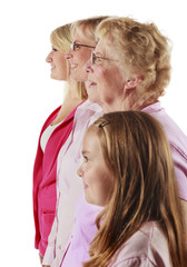 Profile portrait on white background of a grandmother with her daughter and two granddaughters.