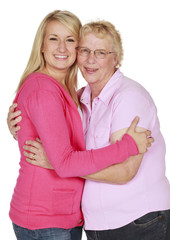 Portrait of a young blonde woman with her grandmother on a white background.