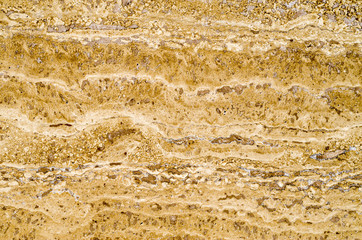 Yellow polished stone closeup