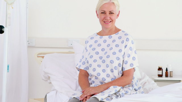 Patient sitting on medical bed