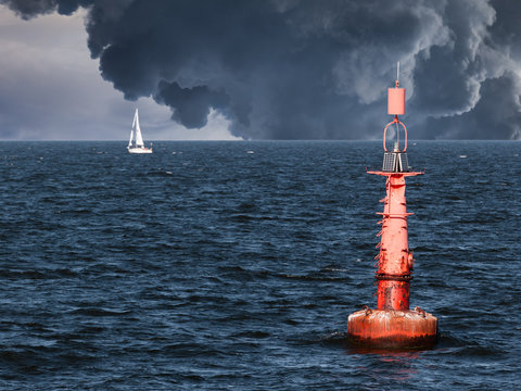 Fototapeta Red buoy on water in a stormy day.