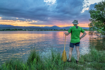 Fototapeta na wymiar canoe paddler watching sunset