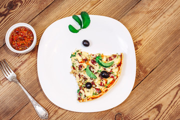 Slise of Pizza homemade with sauce on wooden background 