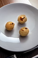 Closeup of Indian street food Pani Puri served on the white plate