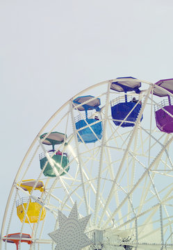 Ferris wheel over blue sky