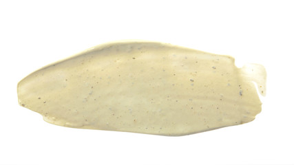Beige color scrub cream stroke on background