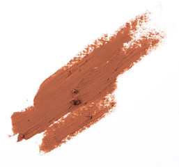 Brown color lipstick stroke on white background